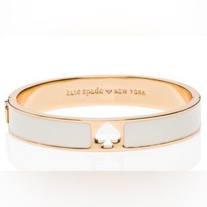 white and gold kate spade hole punch bangle